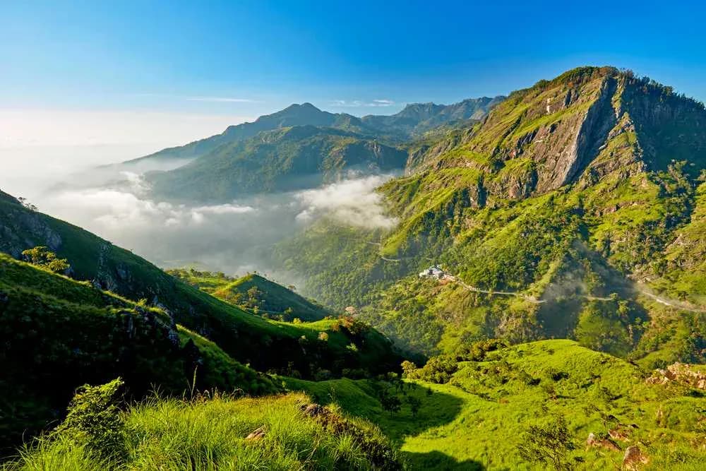 Traveler standing on a mountain peak in Sri Lanka