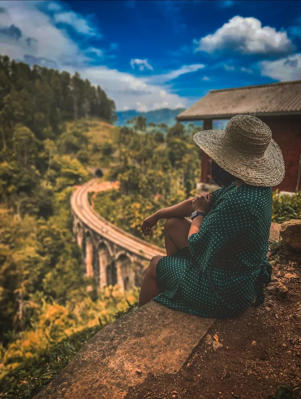 Tourists visiting Labookellie tea plantation viewpoint in Nuwara Eliya, Sri Lanka.