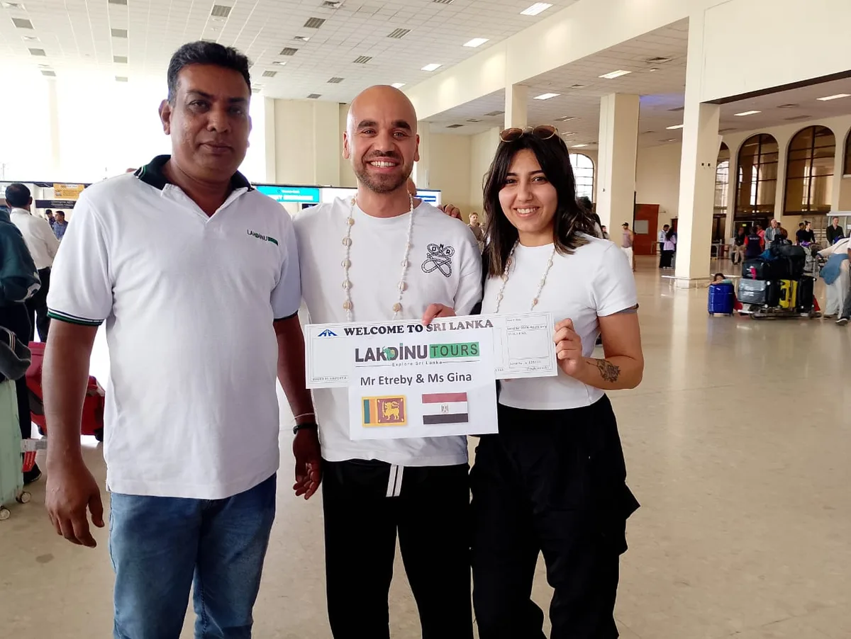 Private chauffeur welcoming international travelers at Bandaranaike International Airport.