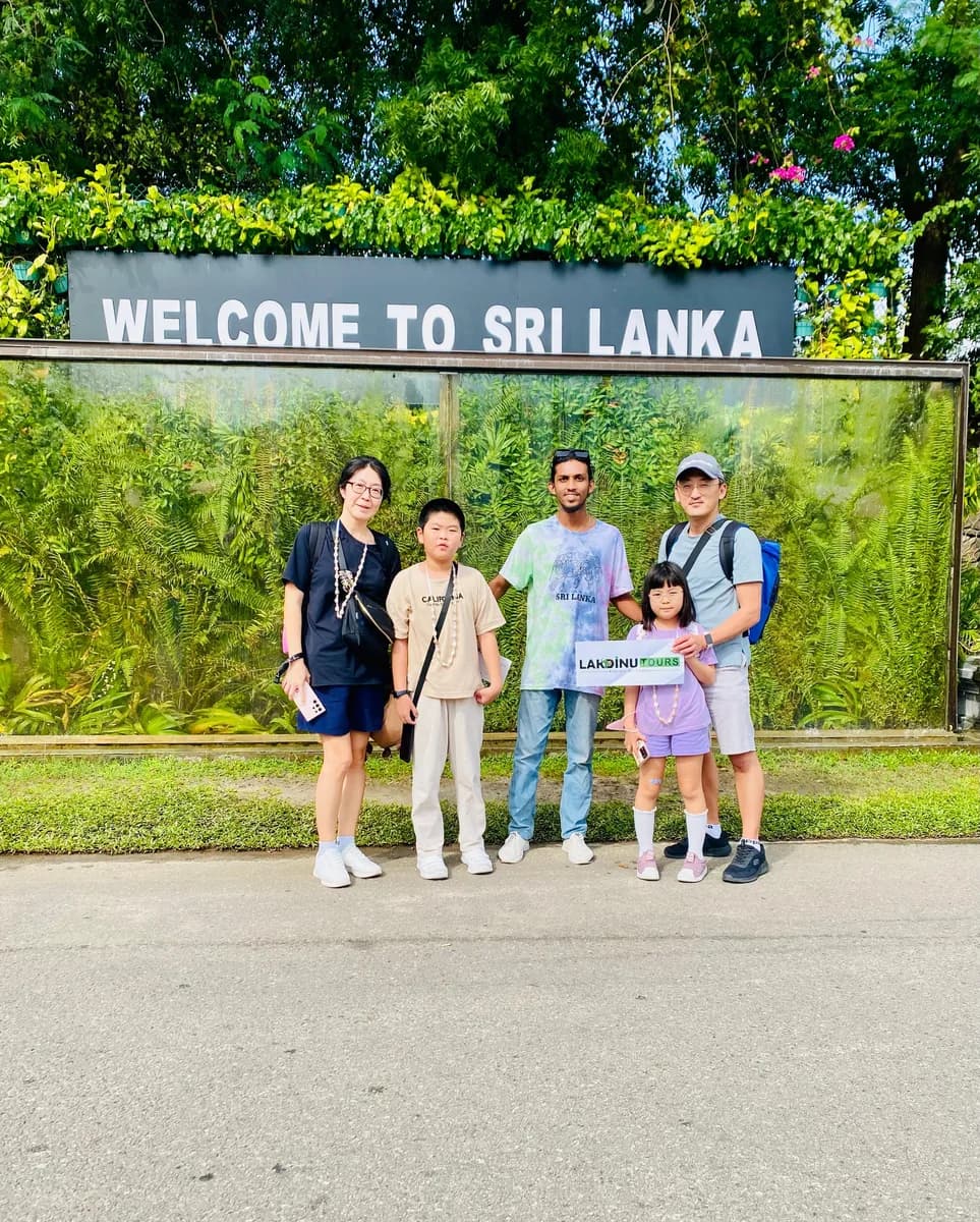 Private driver welcoming a family at Bandaranaike International Airport in Sri Lanka.