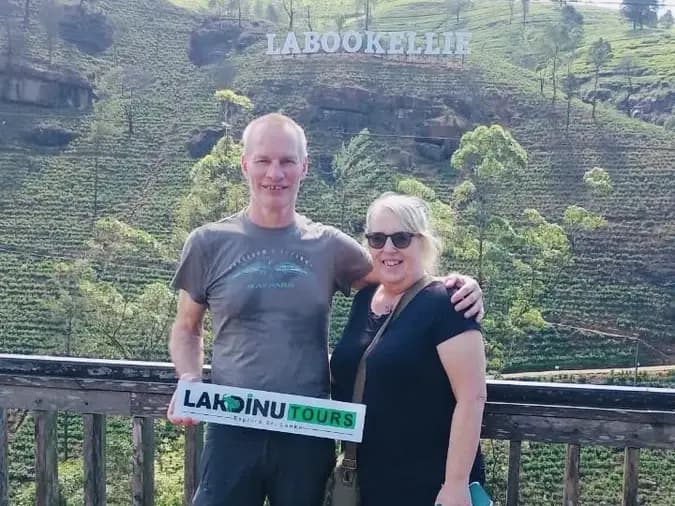 Tourists visiting Labookellie tea plantation viewpoint in Nuwara Eliya, Sri Lanka.