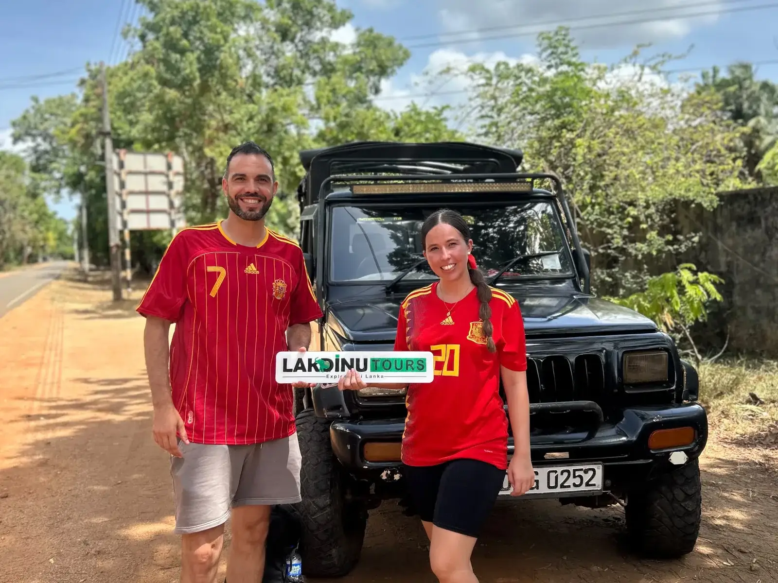 Couple on a safari jeep excursion in a Sri Lanka national park.