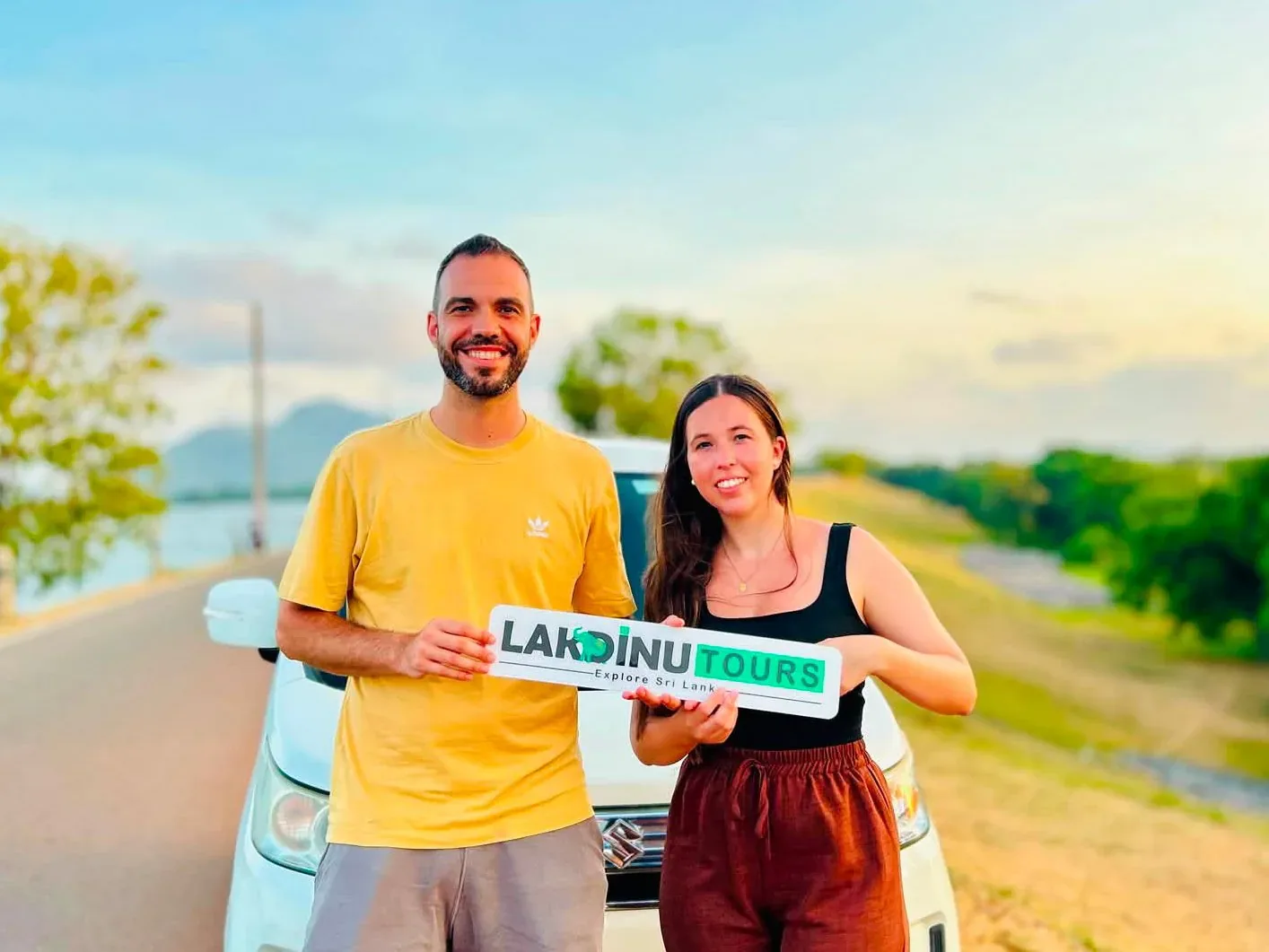 Travelers enjoying a scenic island road trip with a private car driver in Sri Lanka.