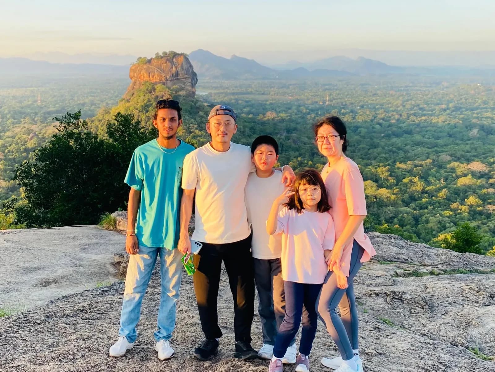Family exploring Sigiriya Rock and Pidurangala with a private driver in Sri Lanka.