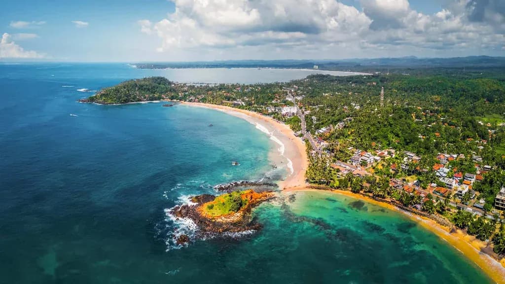 Travelers enjoying a scenic island road trip with a private car driver in Sri Lanka.